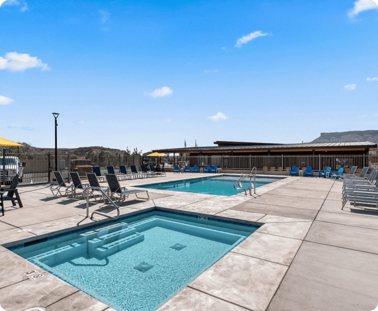 Outdoor pool area with lounge chairs