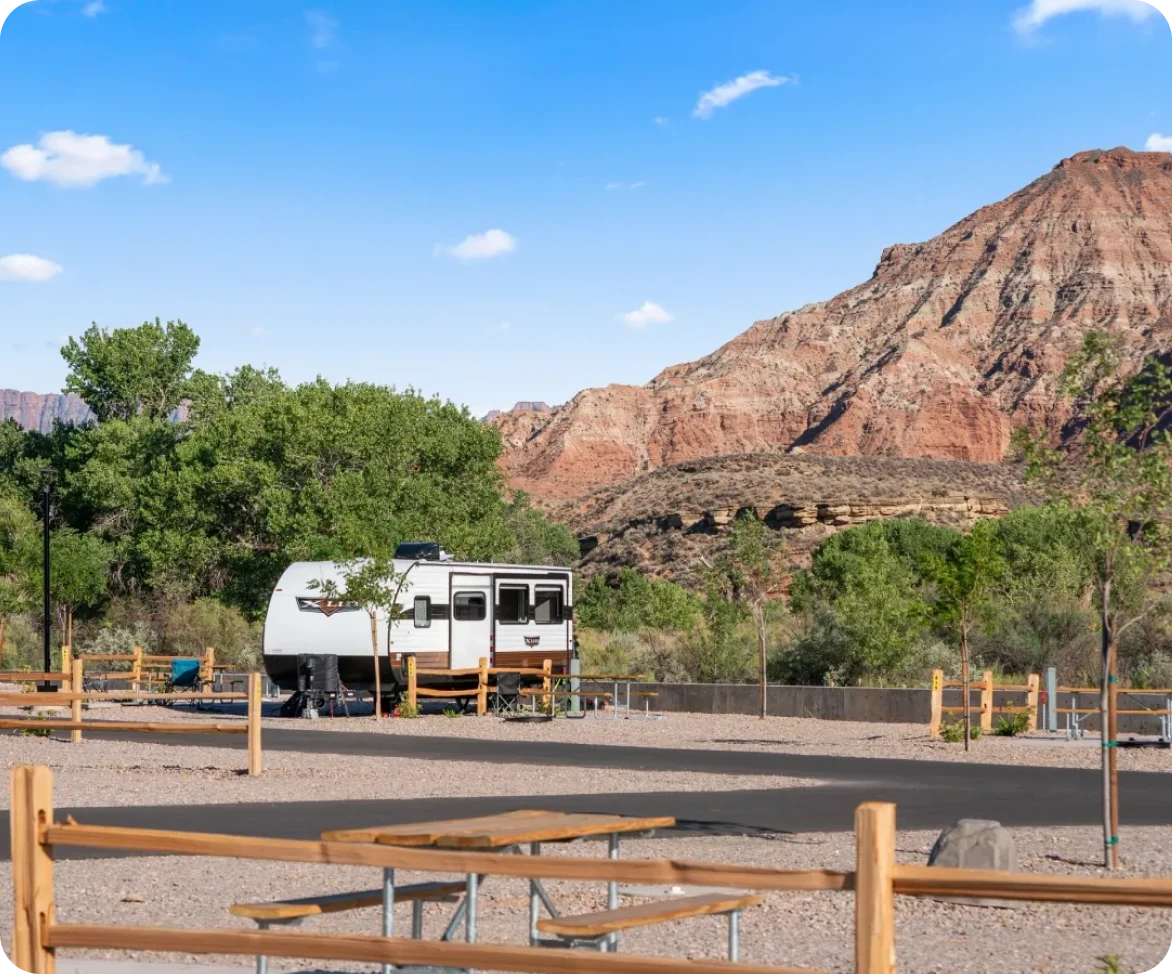 RV parked near red rock mountains